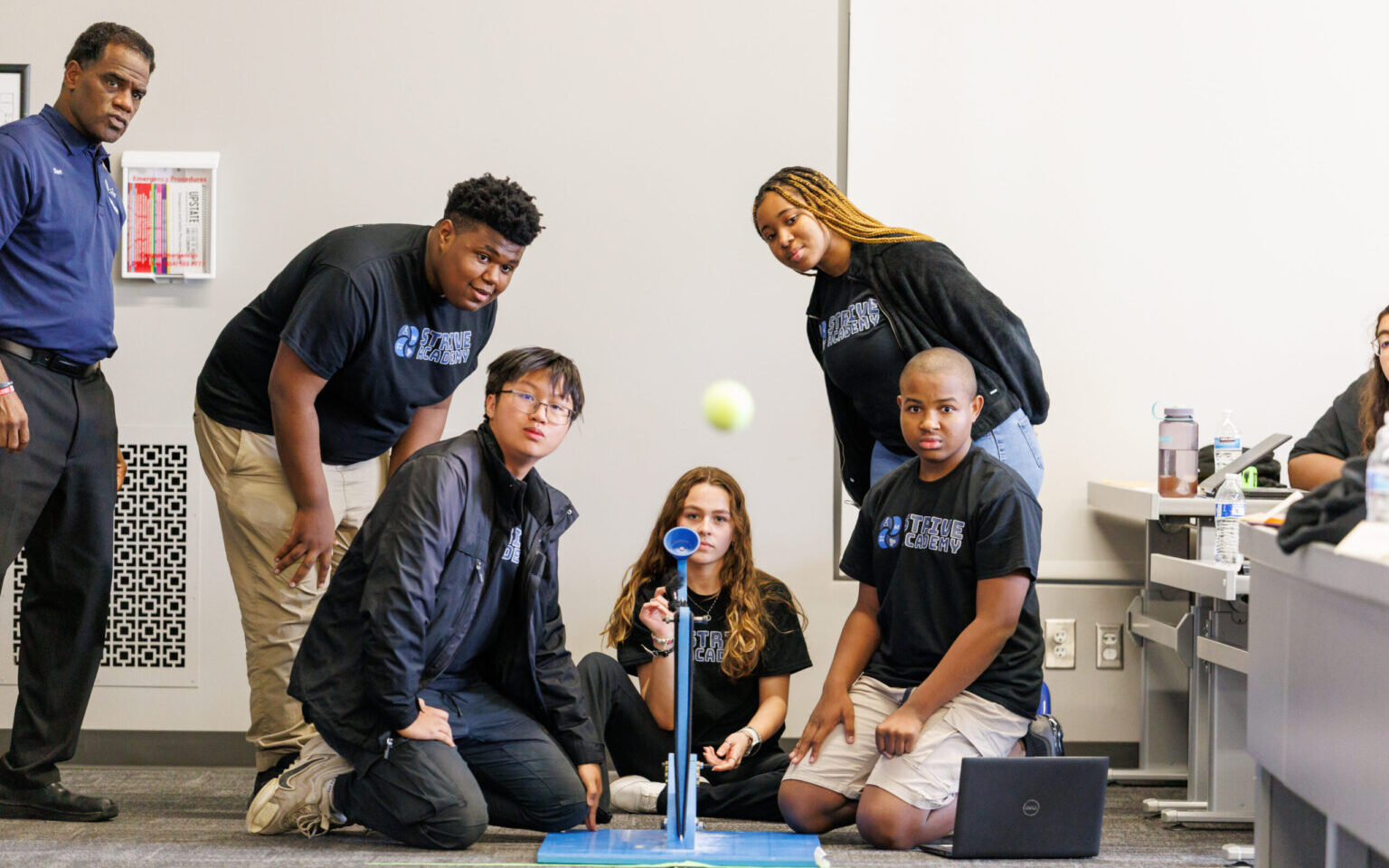 Students testing a small catapult