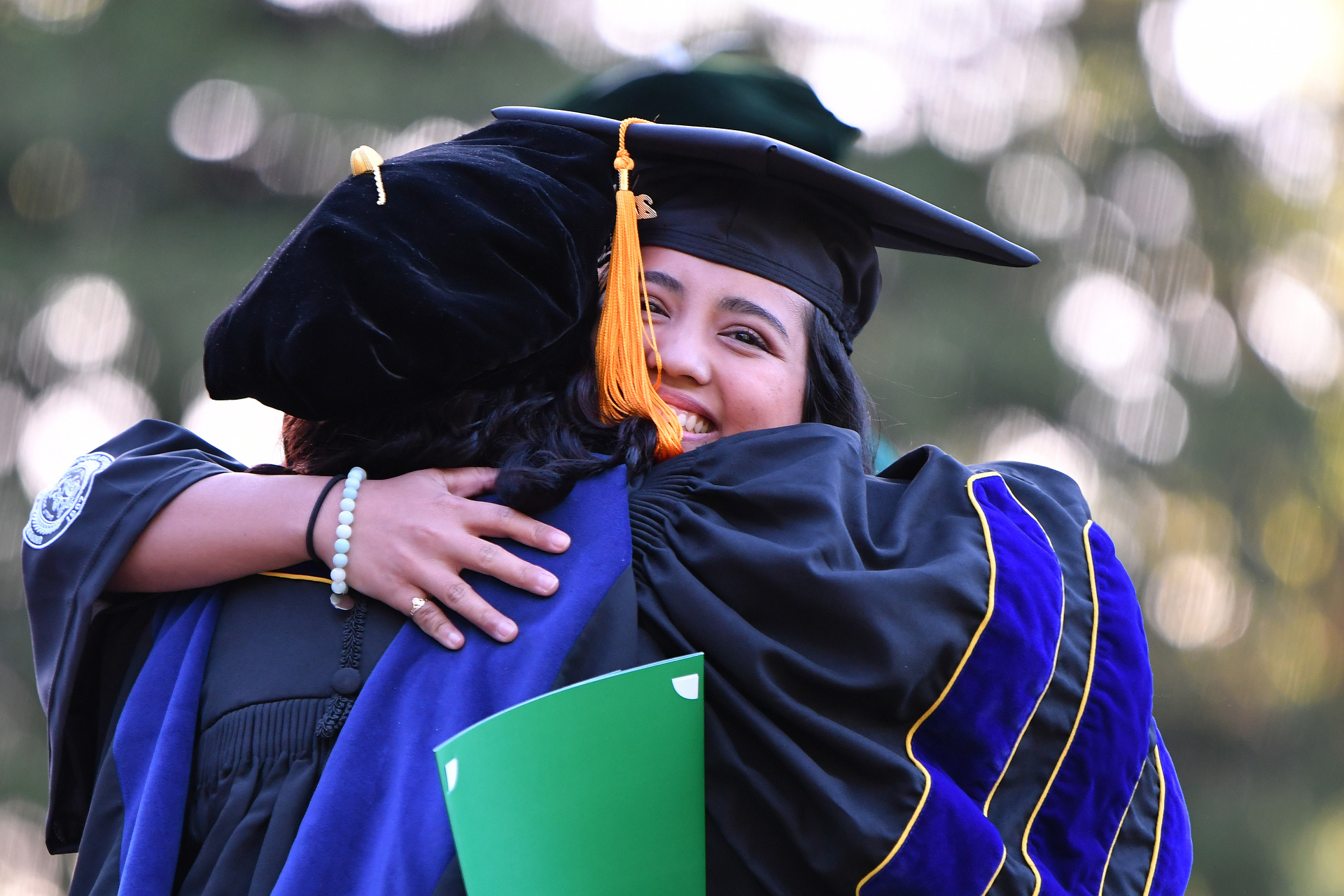 Graduate receives hug