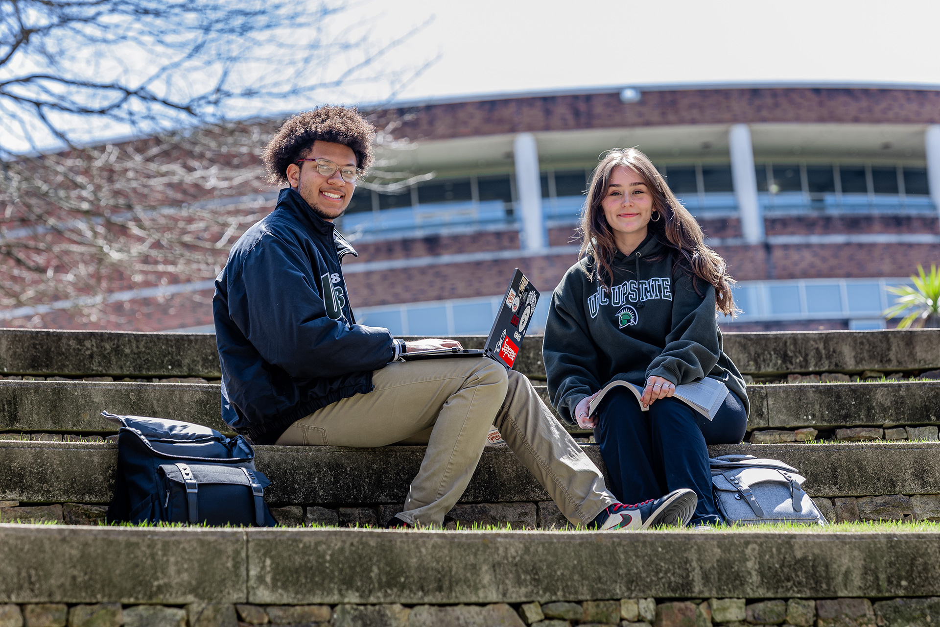 Students sitting on campus steps