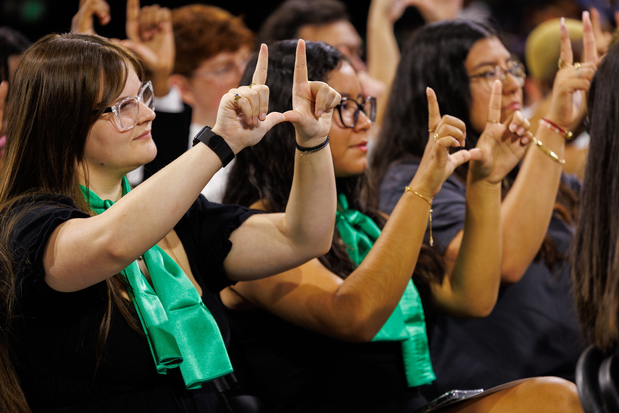 students make a U with their hands  