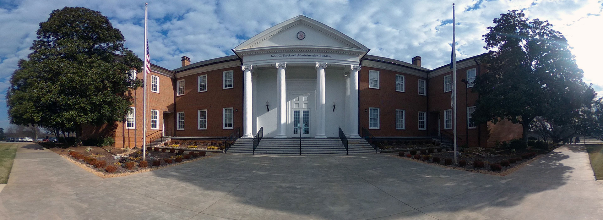 Photo of the Stockwell Administration Building in a 360 degree format, beautiful blue sky with fluffy white clouds.