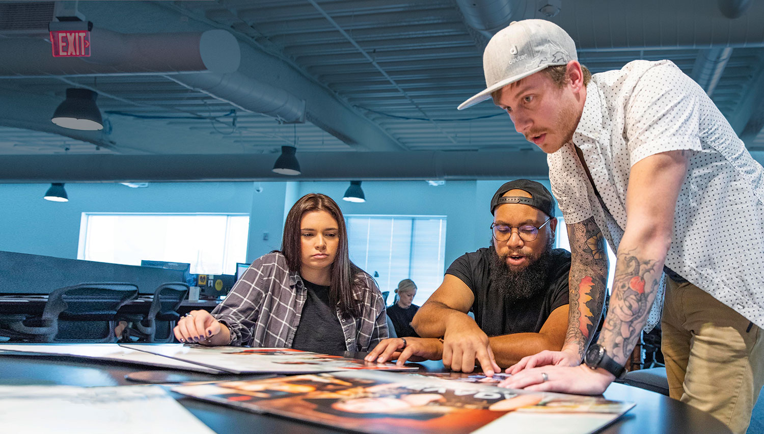 graphic design students looking at designs