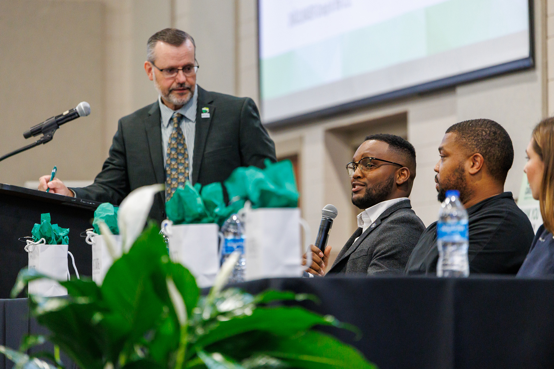 Alumni speakers talking with students at the Global Career Forum