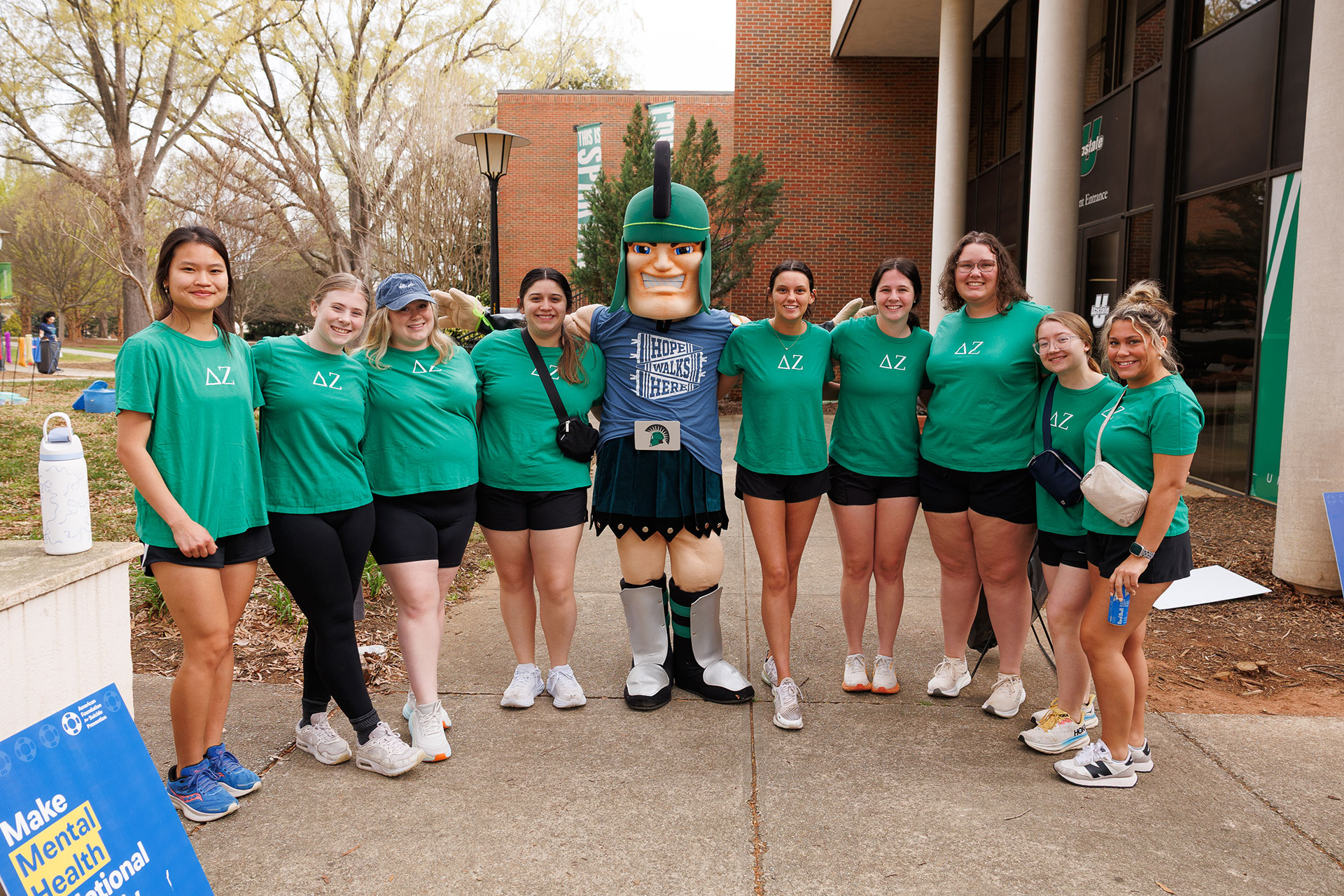 a group of students pose with Sparty