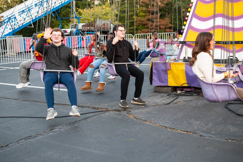 a group of people on a carnival ride