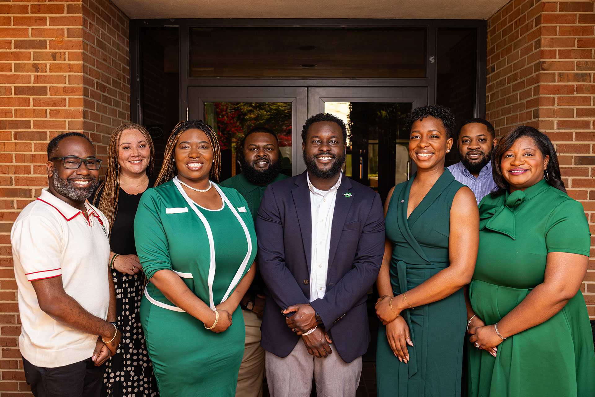 a group of people stand in front of a building