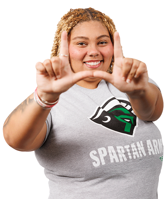 Student showing her USC Upstate pride, putting her hands together to make the Upstate U.