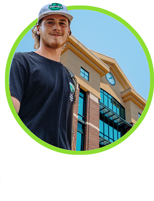 smiling student in a circle graphic or one of USC Upstate Residence Halls
