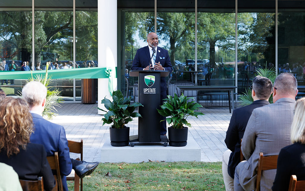 Photo of the chancellor speaking at the ribbon cutting event