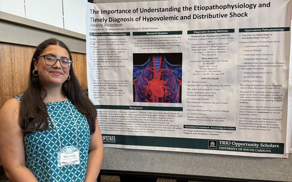 Ansley Woodson standing in front of a poster
