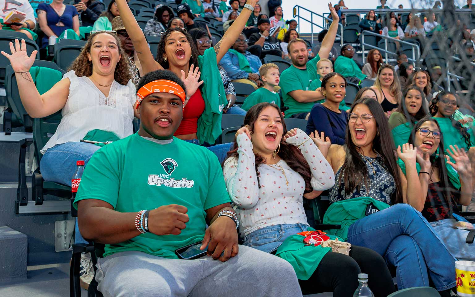 Students at a University event - cheering on the Spartans