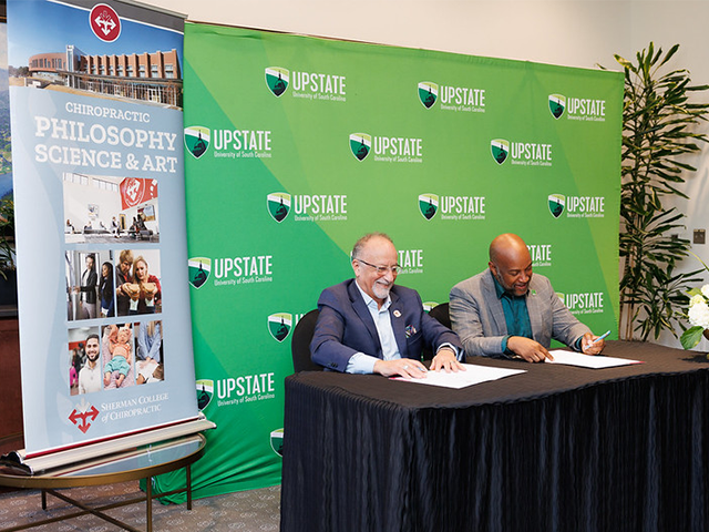 Dr. Bennie Harris of USC Upstate and Dr. Jack Bourla of Sherman College sign MOUs