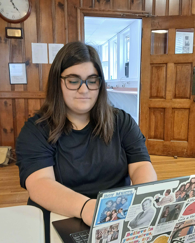 a student looks at a compute