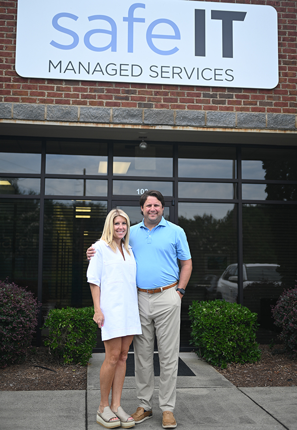 Brad and Sarah Cothran in front of their business