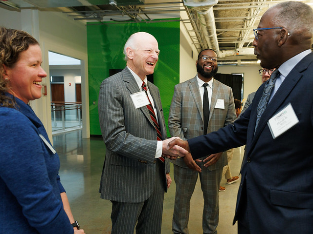 William Hubbard and Retired Chief Justice Donald Beatty shake hands at the new CHAMPS Beatty Center, marking the official launch of the medical-legal partnership in South Carolina.