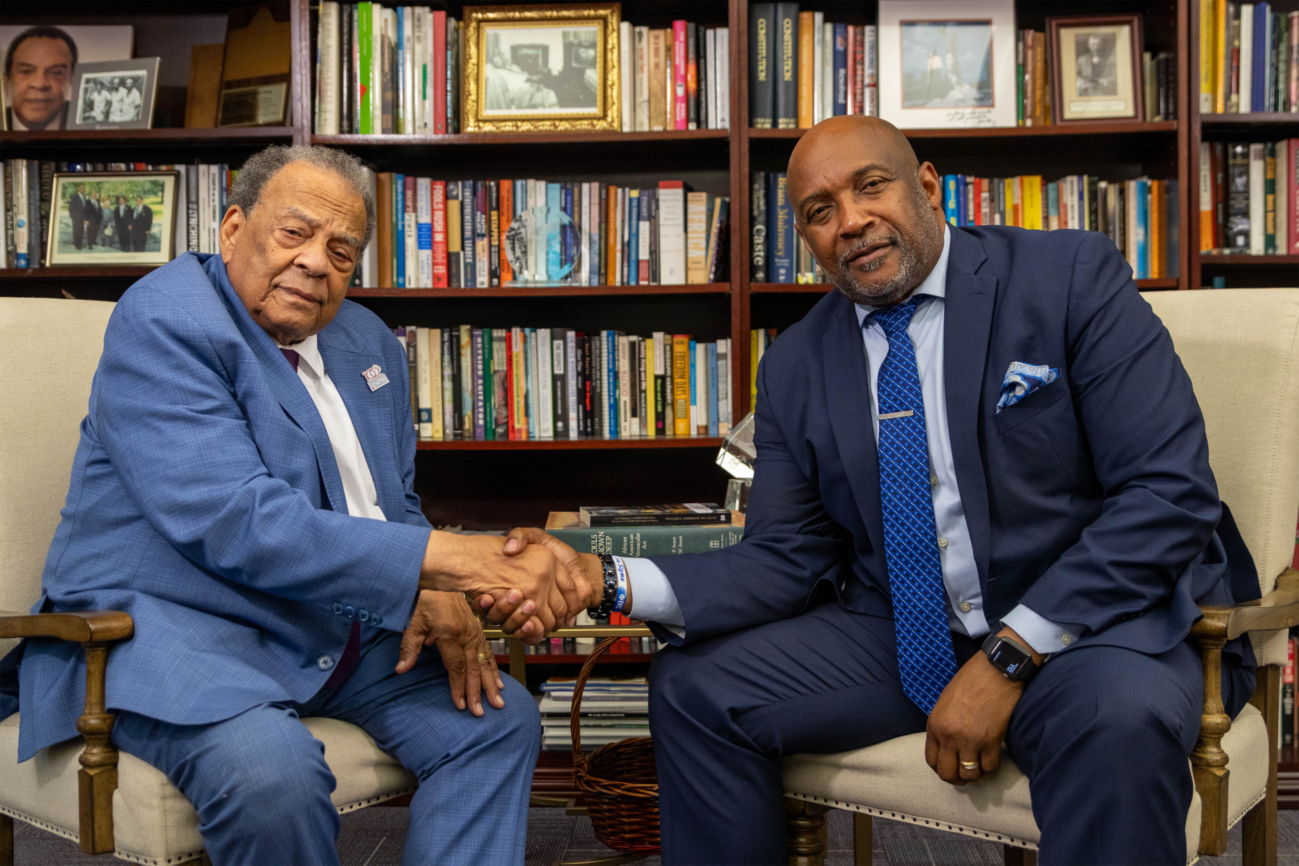 Andrew Young shakes hands with USC Upstate Chancellor Bennie Harris during their Below The Line podcast interview.