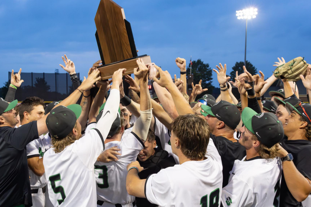 USC Upstate Baseball team hoists the championship trophy into the air.