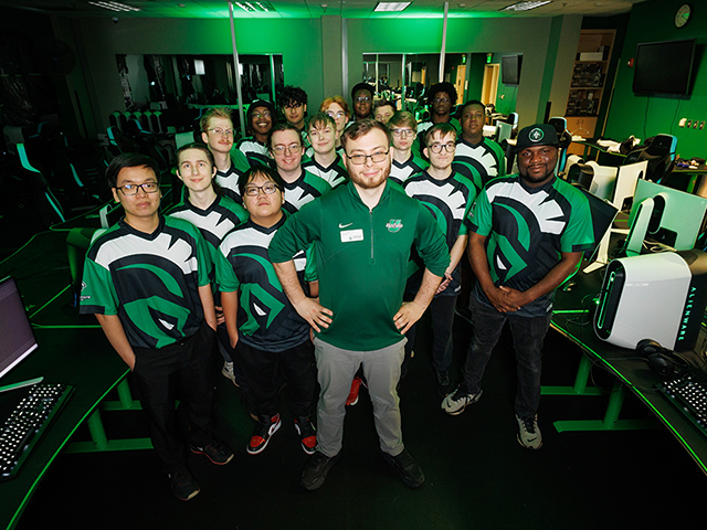 Esports team group photo in computer lab