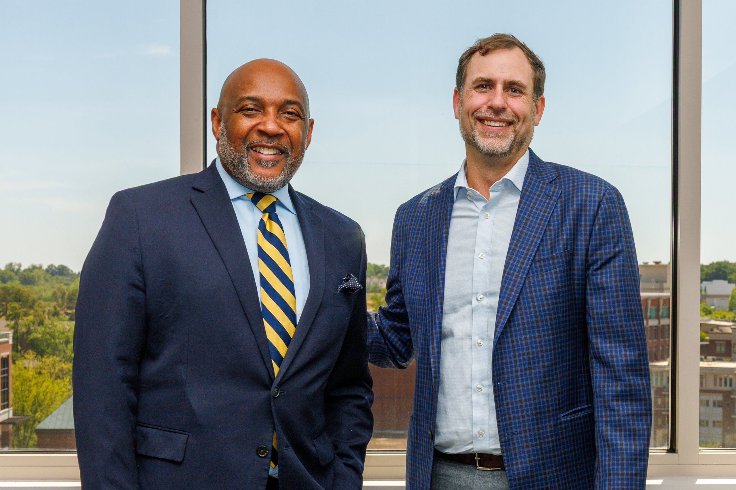 Dr. Bennie Harris stands with Tim Pearson