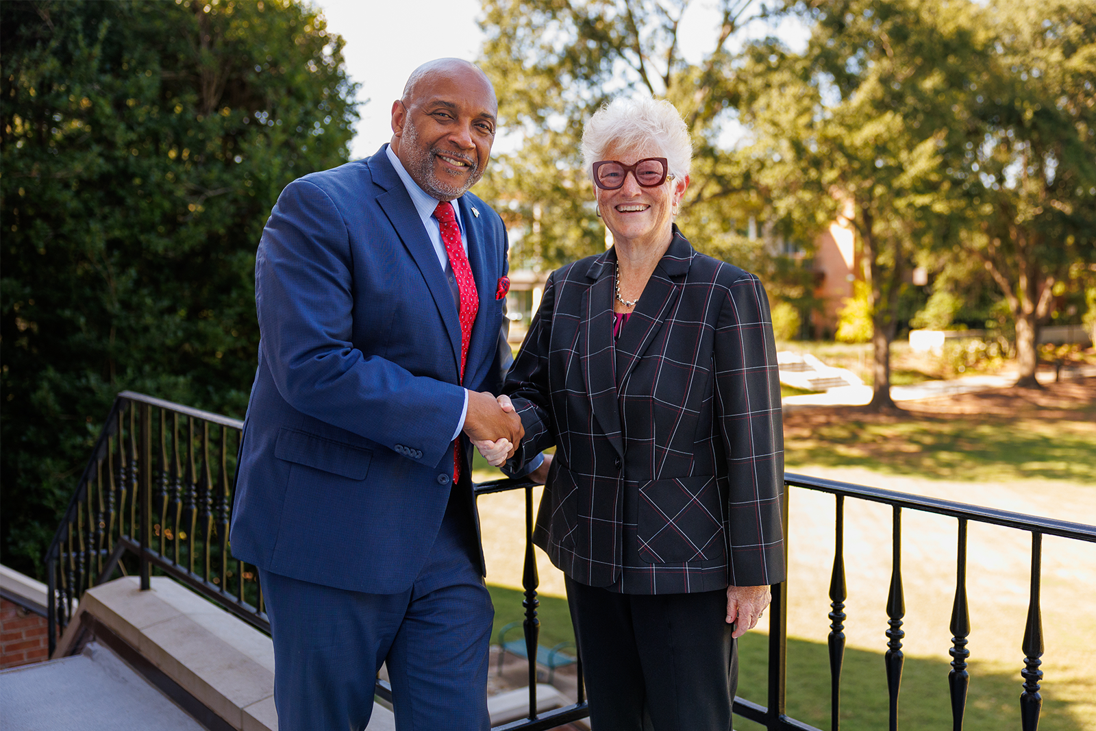 Rebecca West and Dr. Bennie Harris pose together.